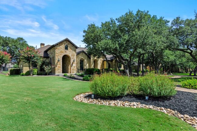 167 Estrella Xing | Beautiful house with manicured lawn and trees.