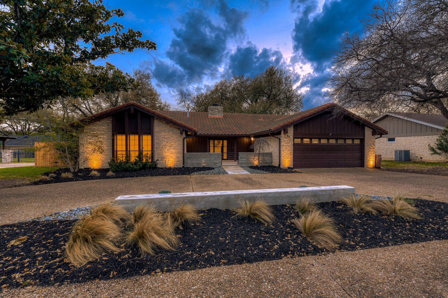 Cozy house with evening lights on.