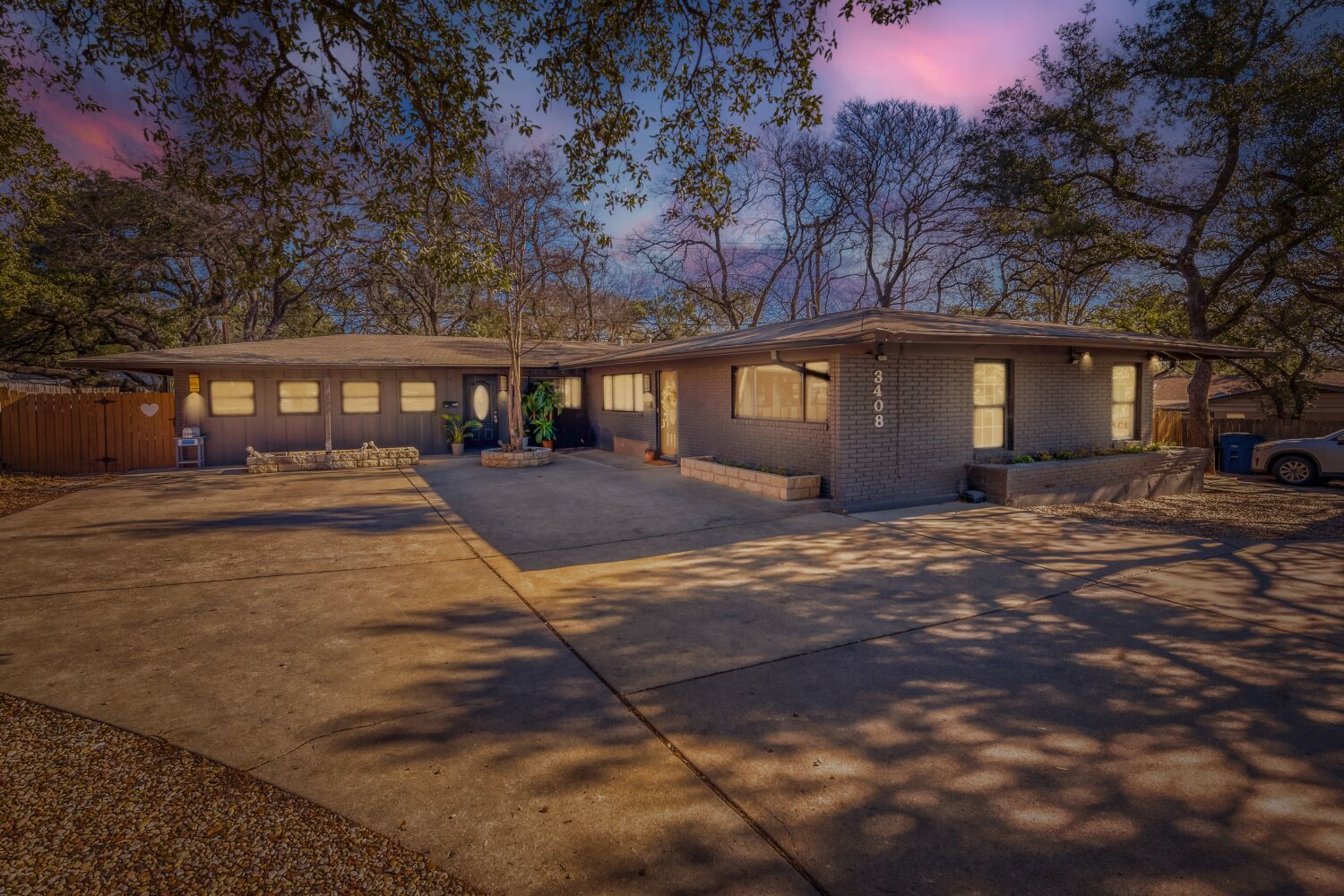 Modern house with sunset sky and trees