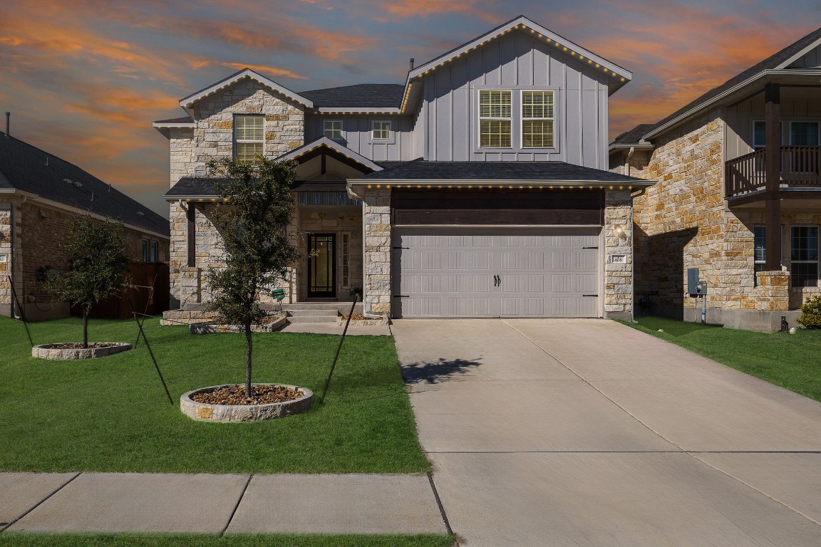 Modern suburban house with garage and driveway.