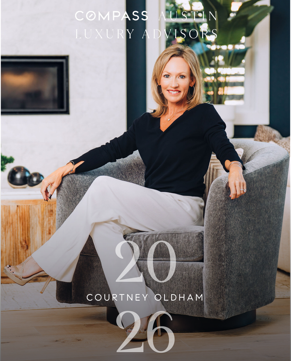 Woman sitting in a luxury home interior.