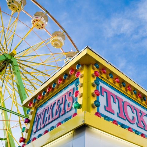 Ferris wheel and colorful ticket booth