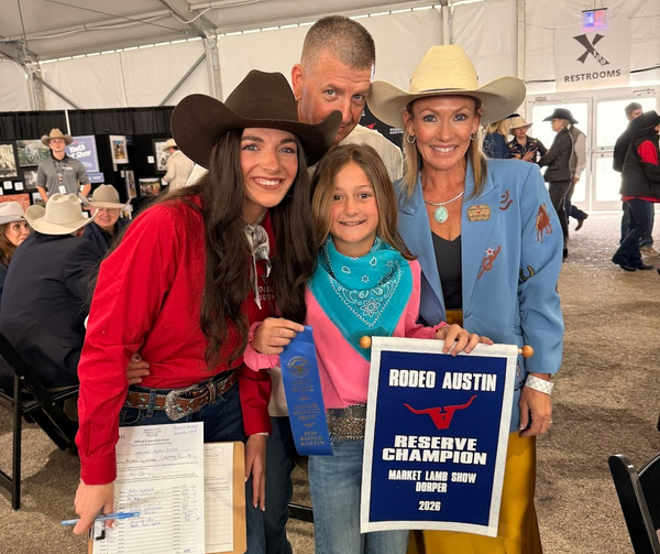 Family celebrates Rodeo Austin achievement.