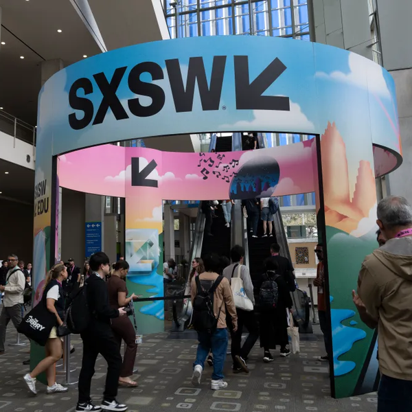 SXSW entrance with people and escalator