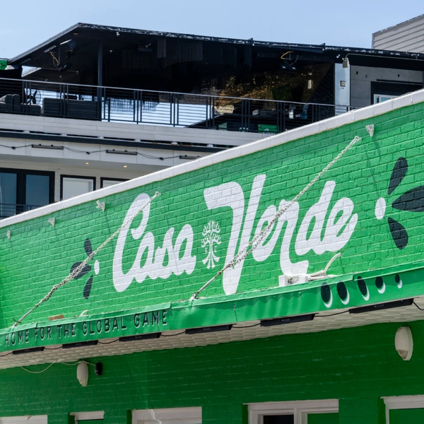 Green brick building with Casa Verde sign