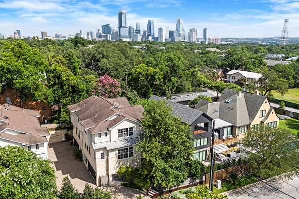 Suburban homes with city skyline in background