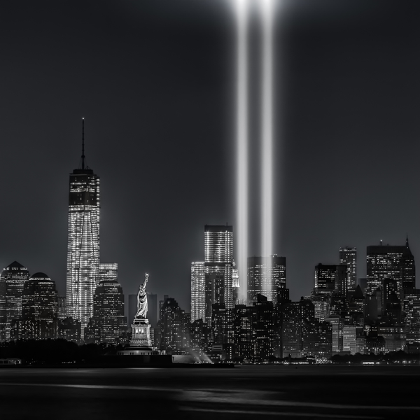 Tribute in Light beams over Lower Manhattan and Statue of Liberty