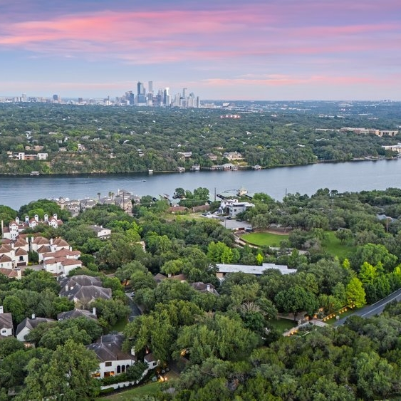 Aerial view of city, river, and greenery