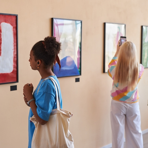 People viewing abstract art in a gallery