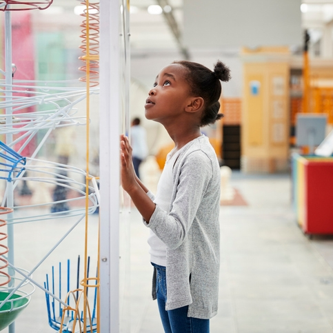 Child gazing at an interactive exhibit.