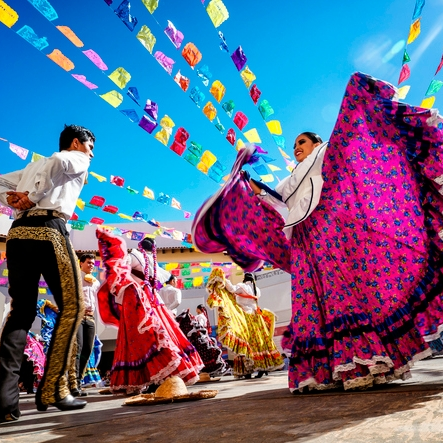 Rope Trix Folkloric dancers twirl beneath colorful papel picado banners