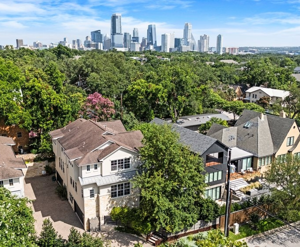 Suburban homes with downtown skyline in background