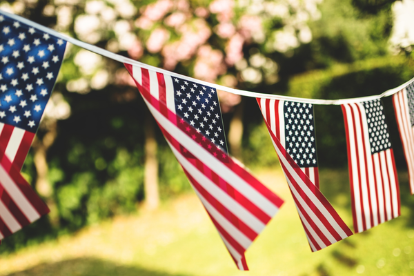 American flags hanging on outdoor string line